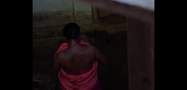  Desi village horny bhabhi nude bath show caught by hidden cam